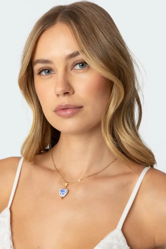 Heart Bow Necklace sold by Edikted