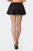Kaden Grommet Bubble Mini Skort sold by Edikted