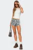 Nikki Nylon Shorts sold by Edikted