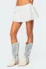 Dora Eyelet Flared Mini Skirt sold by Edikted