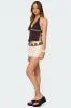 Pearlsy Button Backless Halter Top sold by Edikted