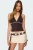 Pearlsy Button Backless Halter Top sold by Edikted