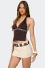 Pearlsy Button Backless Halter Top sold by Edikted