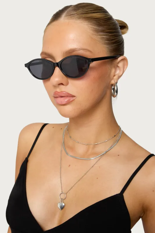 Arlo Oval Sunglasses sold by Edikted
