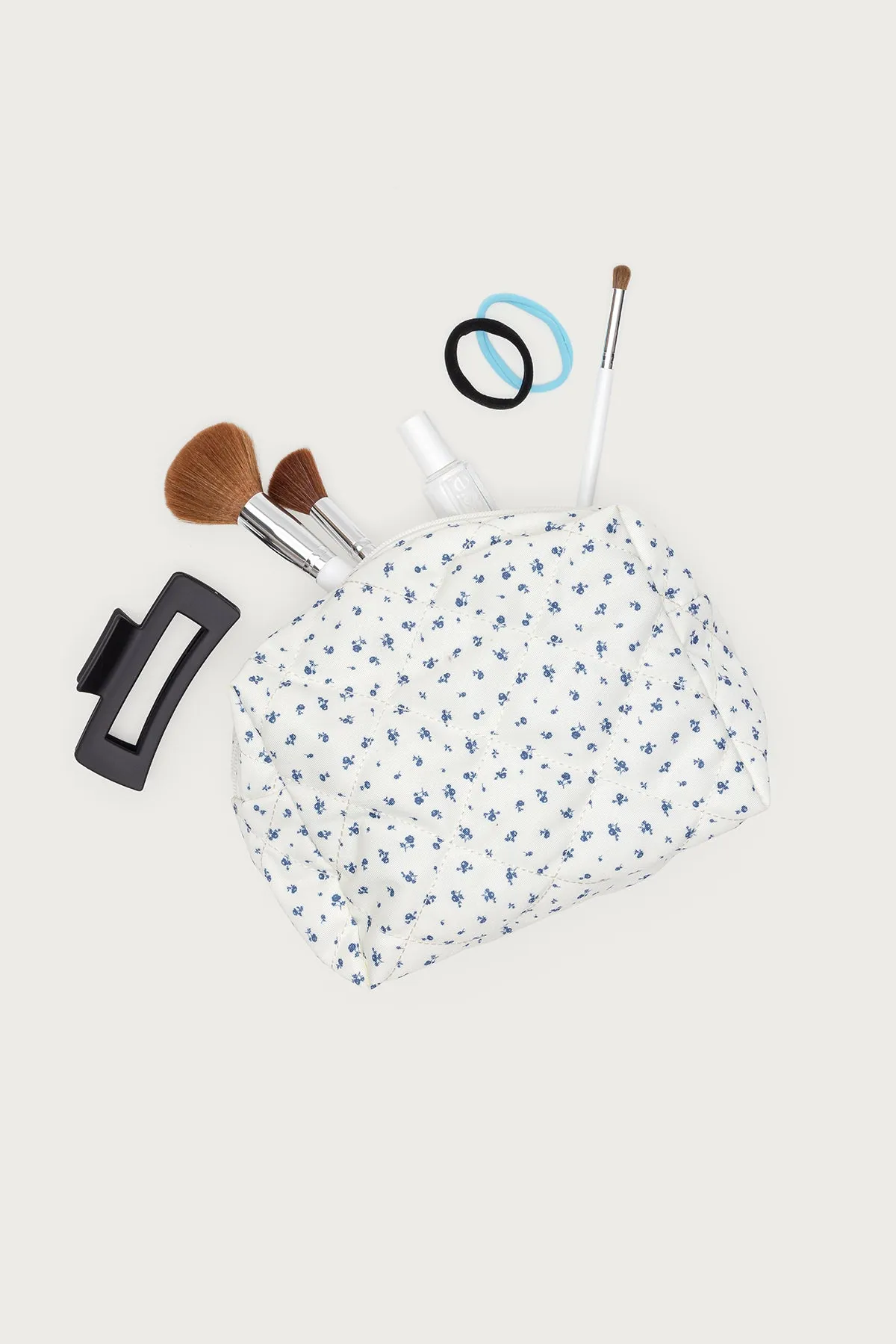 Bloomy Quilted Makeup Bag sold by Edikted