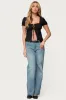 Lacey Split Front Lace Up Top sold by Edikted