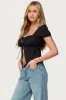 Lacey Split Front Lace Up Top sold by Edikted