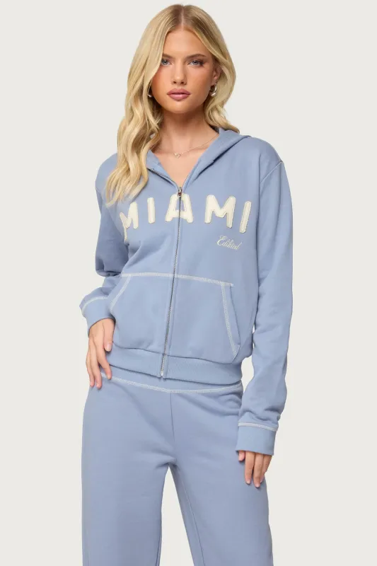 Miami Babe Zip Up Hoodie sold by Edikted
