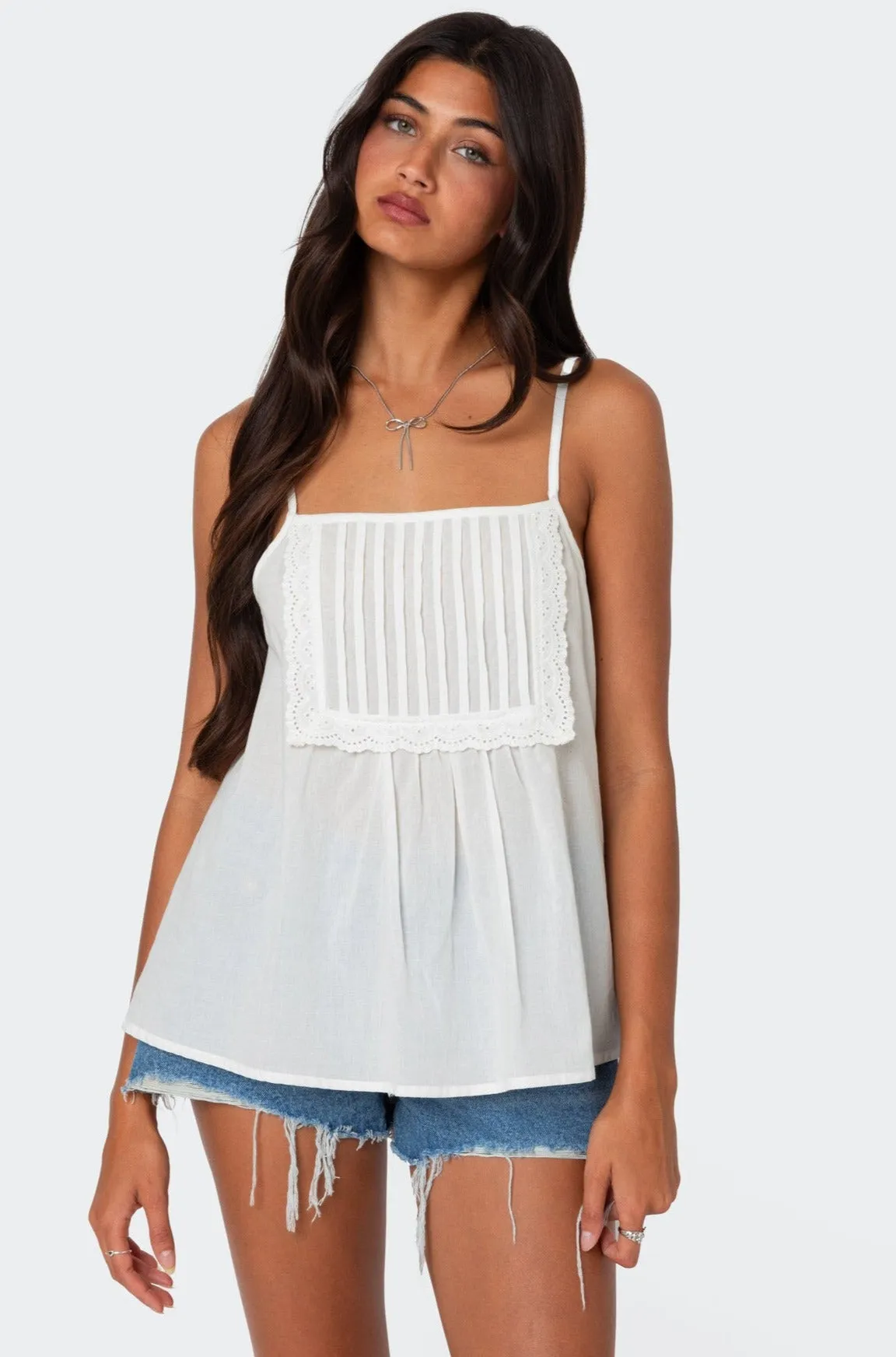 Eyelet Trim Paneled Top sold by Edikted