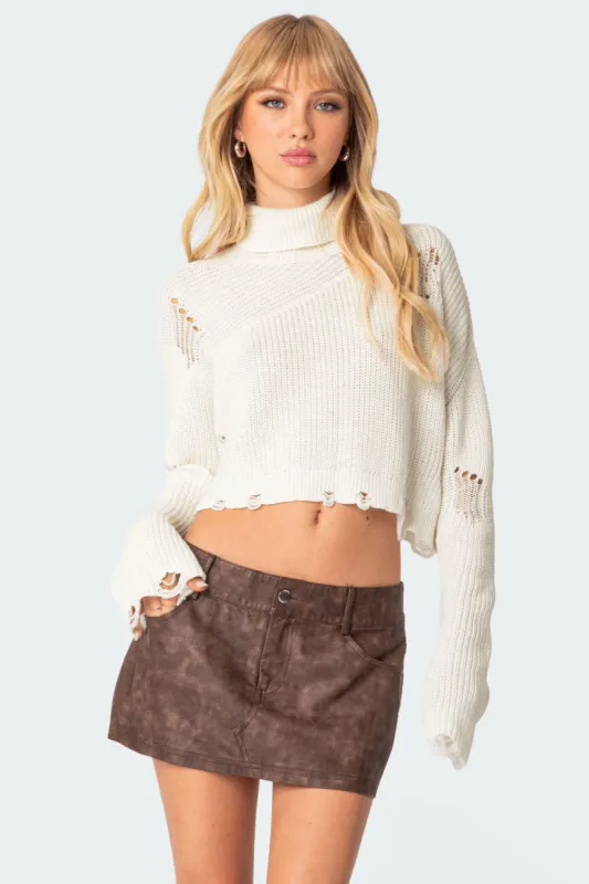 Distressed Turtle Neck Cropped Sweater sold by Edikted