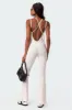 Strappy Ribbed Open Back Flared Jumpsuit sold by Edikted