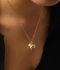 Gold Charm Necklace - Ocean sold by Andie