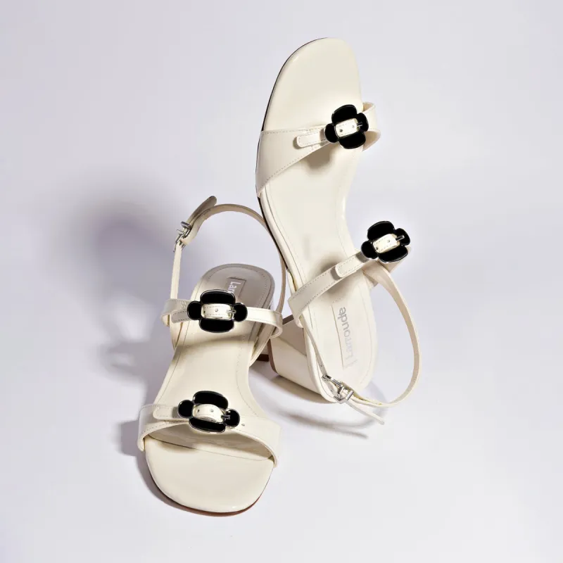 Tinx Block In Ivory Patent Leather sold by Andie