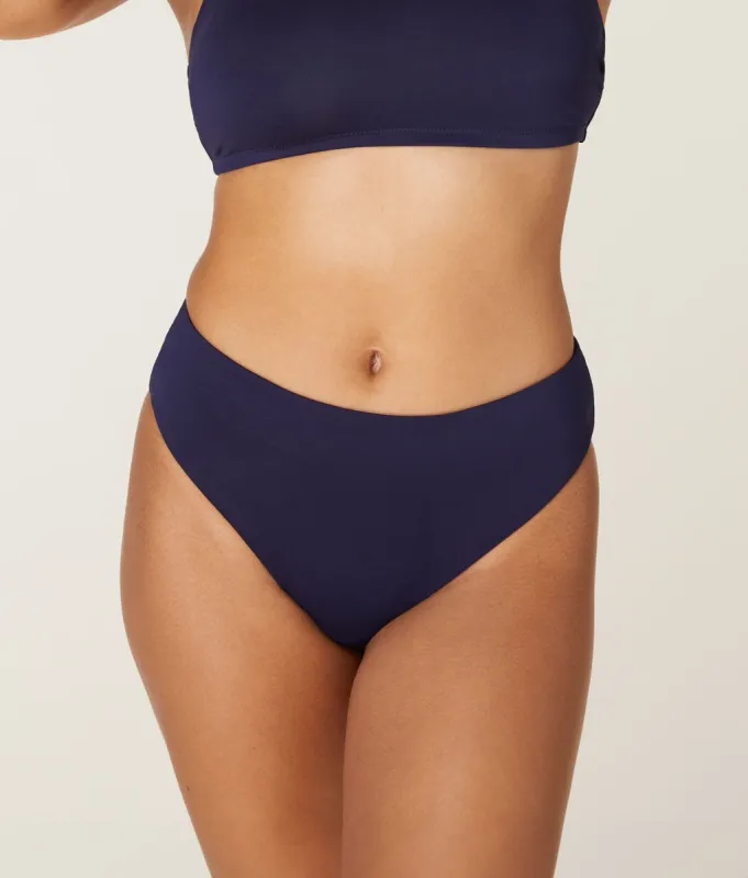 The 90s High Waist Bikini Bottom - Eco - Navy sold by Andie