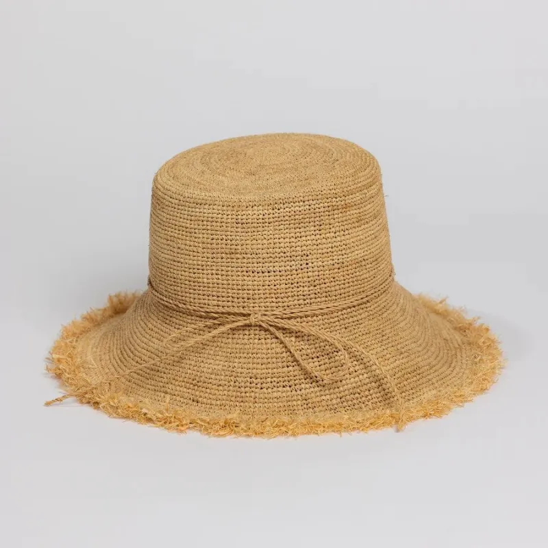 Packable Raffia Bucket sold by Andie