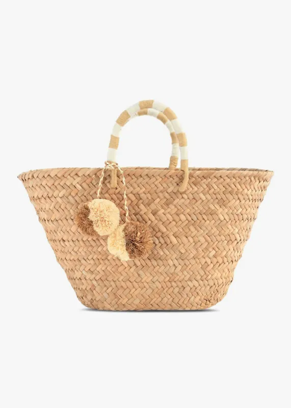 St Tropez Pom Pom Straw Tote sold by Andie