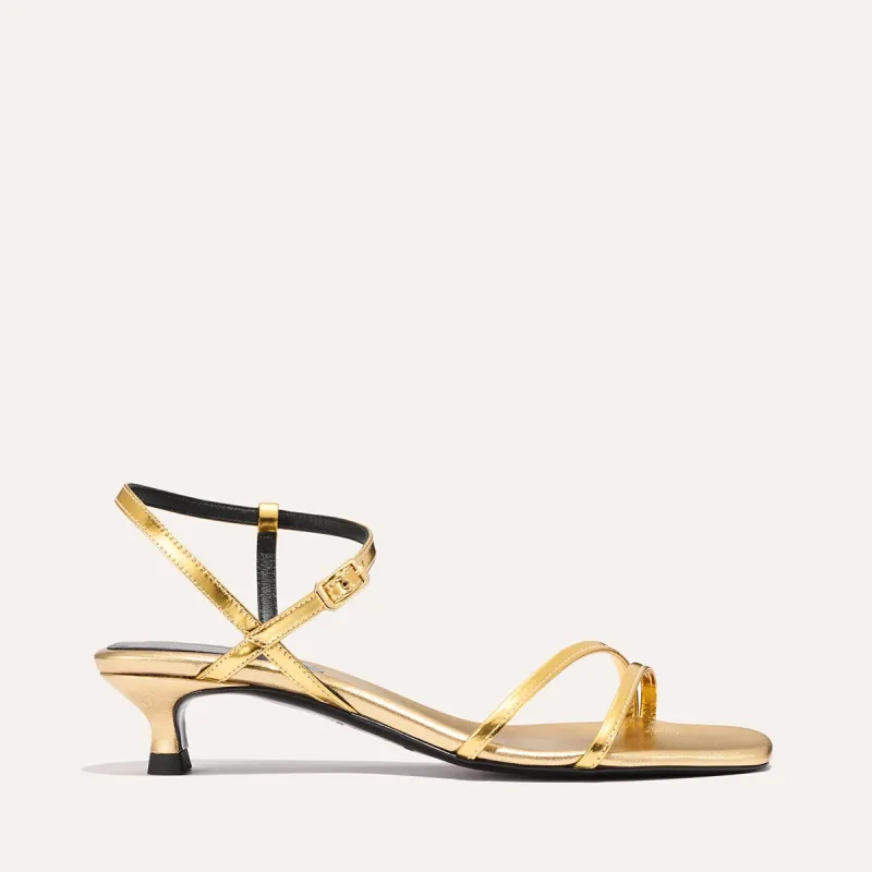 The Dylan Sandal - Gold Mirror sold by Margaux
