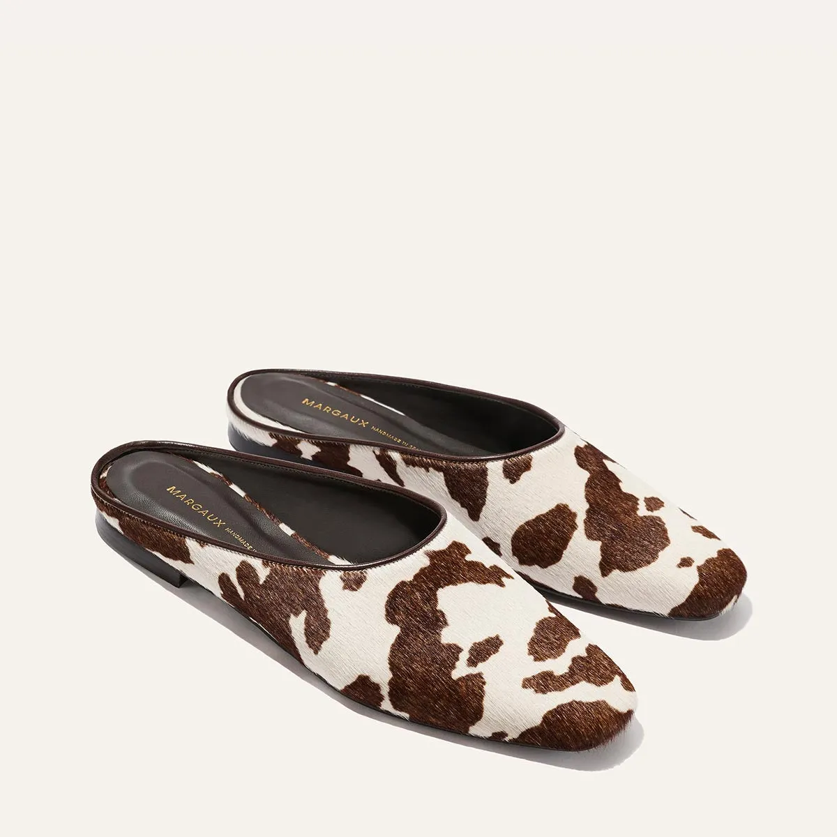 The Clara - Cow Print Haircalf sold by Margaux