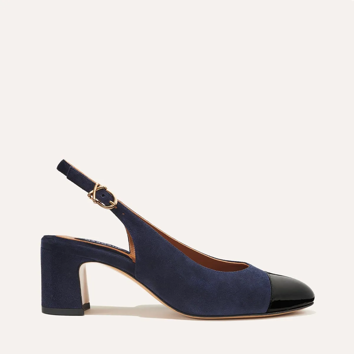 The Cluny Slingback - Navy Suede and Black Patent sold by Margaux