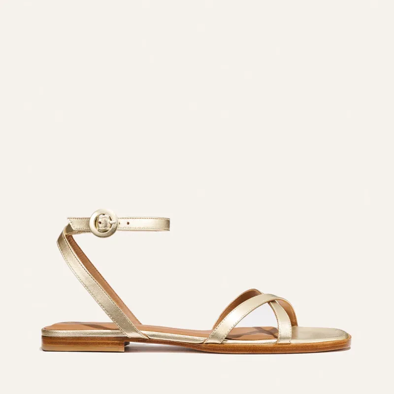 The Flat Sandal - Champagne Nappa sold by Margaux