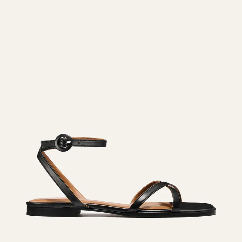 The Flat Sandal - Black Nappa sold by Margaux