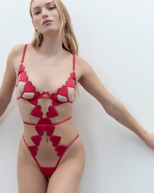 Gia Open Heart Bodysuit Pink sold by Bluebella