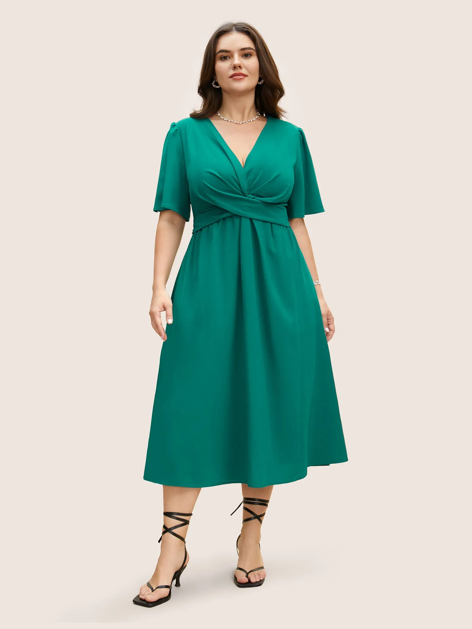 Solid Shirred Crossover Flutter Sleeve Dress sold by Bloomchic