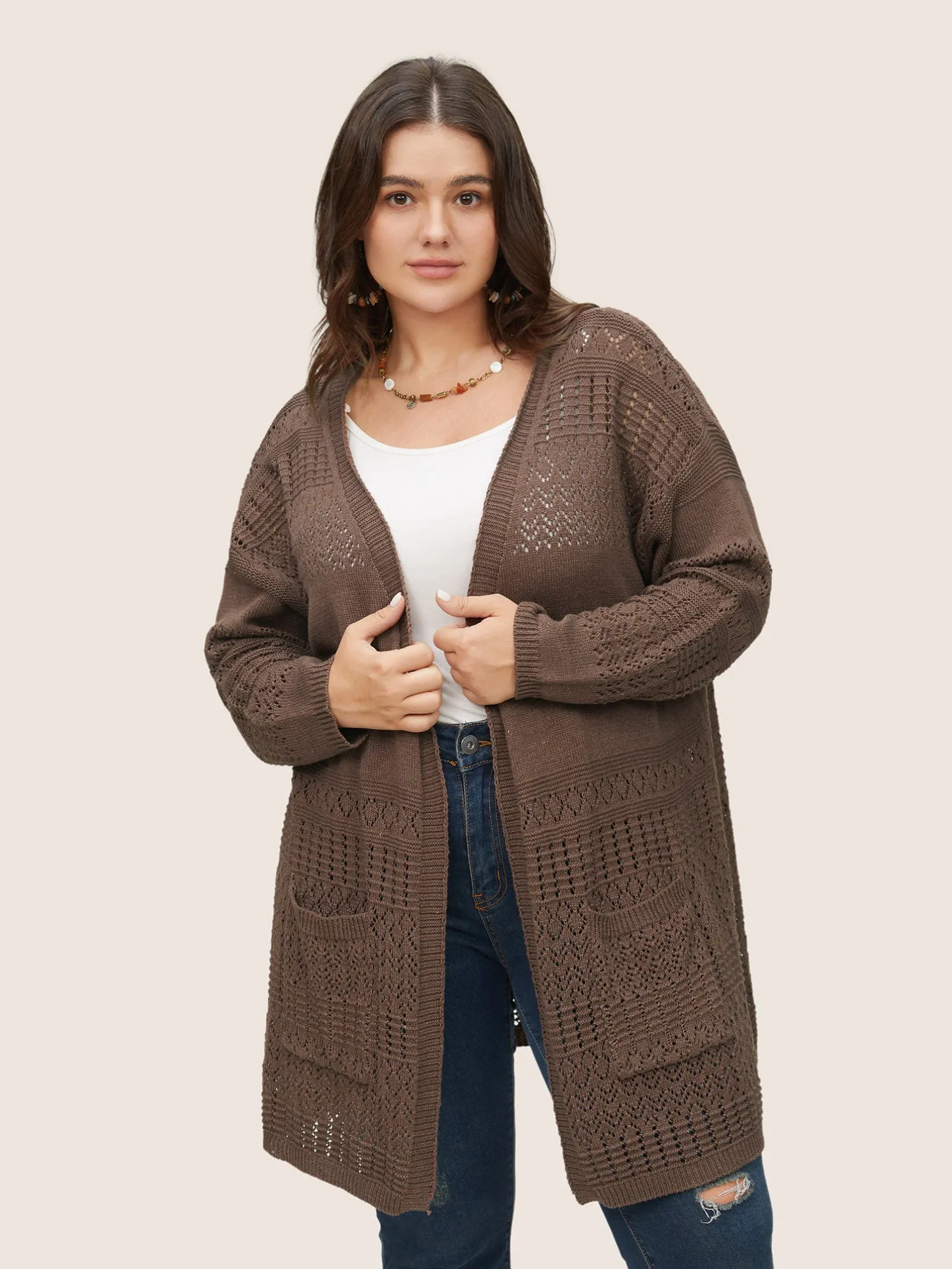 Solid Geometric Hollow Out Pocket Cardigan sold by Bloomchic