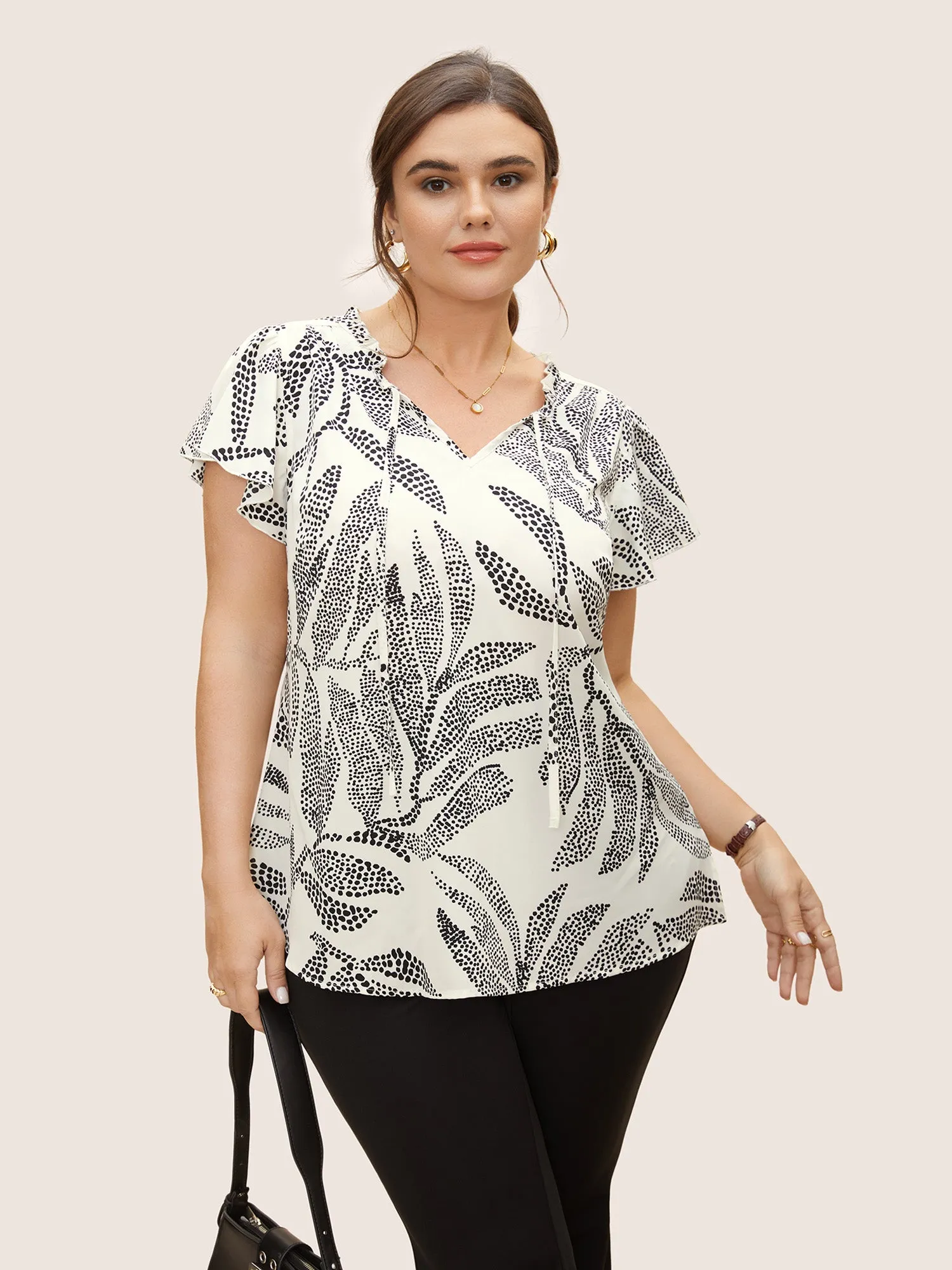 Polka Dot Tie Knot Slit Side Blouse sold by Bloomchic