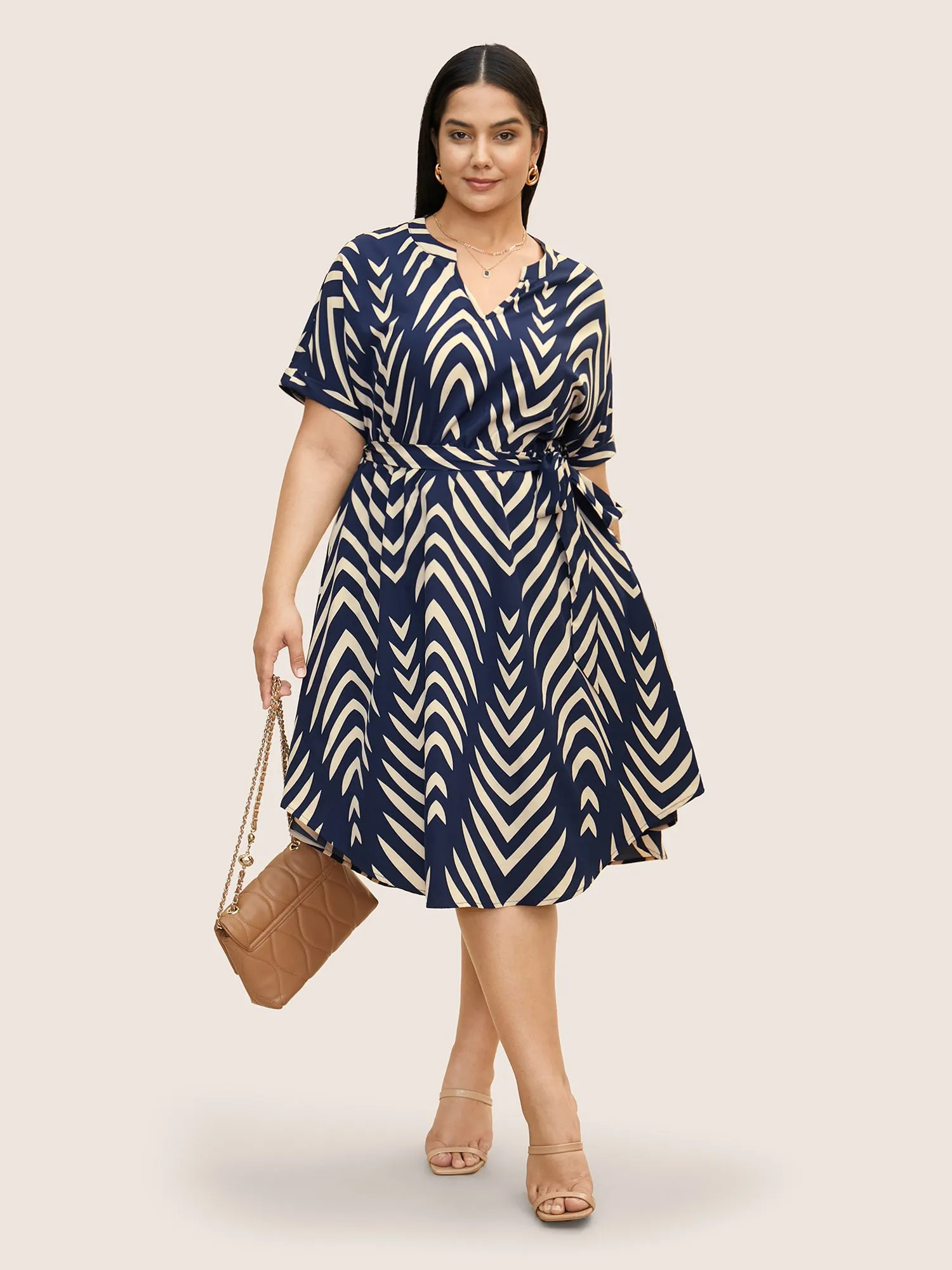 Geometric Belted Dolman Sleeve Curved Hem Dress sold by Bloomchic