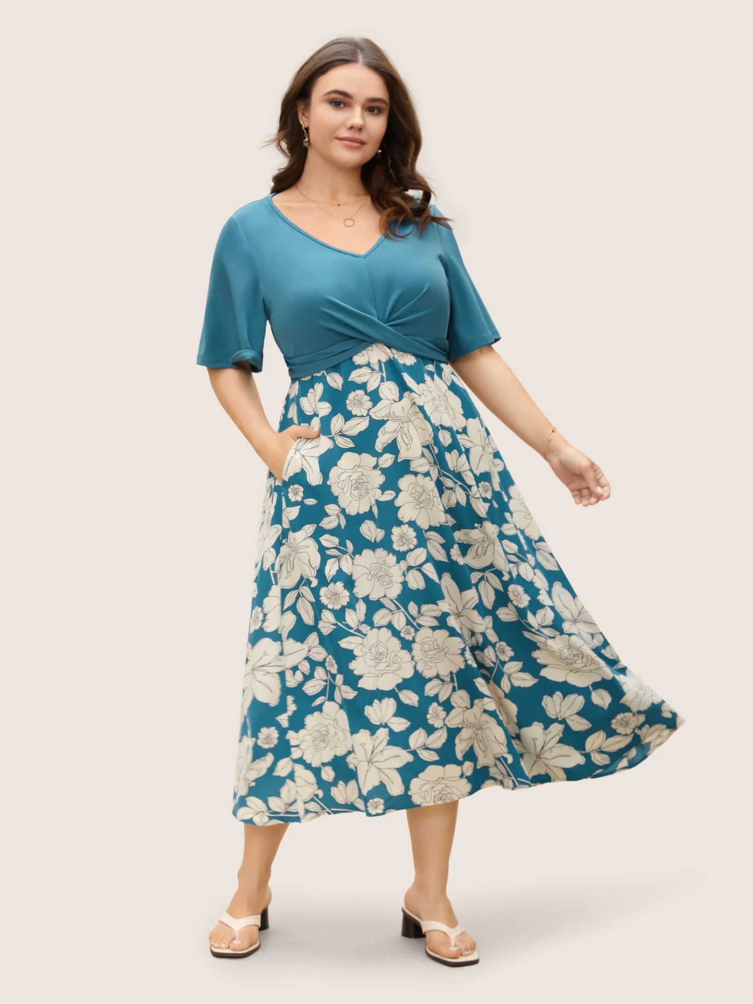Floral Patchwork Twist Front Midi Dress sold by Bloomchic