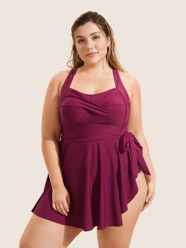 Plain Crossover Knotted Asymmetrical Hem Swim Dress made by Bloomchic