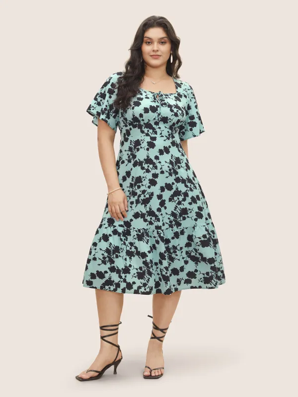 Silhouette Floral Print Knot Neck Flutter Hem Dress sold by Bloomchic