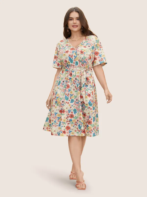Floral Overlap Collar Belted Pocket Dress sold by Bloomchic
