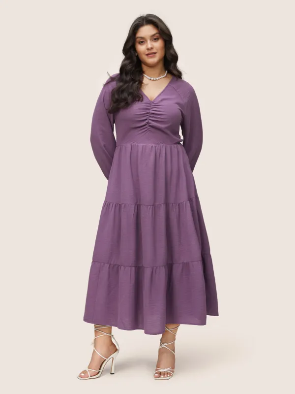 Solid Ruched Raglan Sleeve Layered Hem Dress sold by Bloomchic