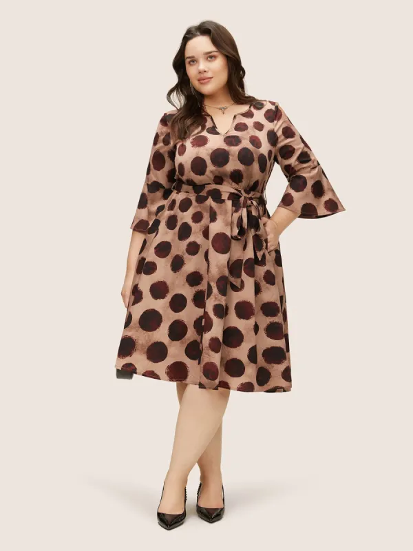 Geometric Notched Bell Sleeve Belted Dress sold by Bloomchic
