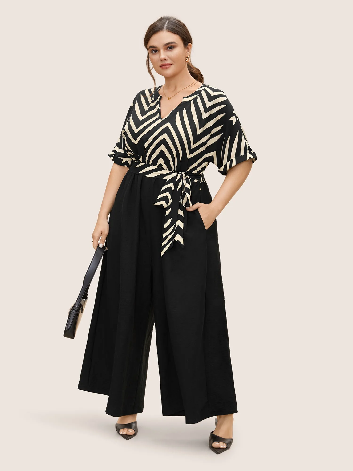 Striped Patchwork Knot Cuffed Sleeve Jumpsuit sold by Bloomchic