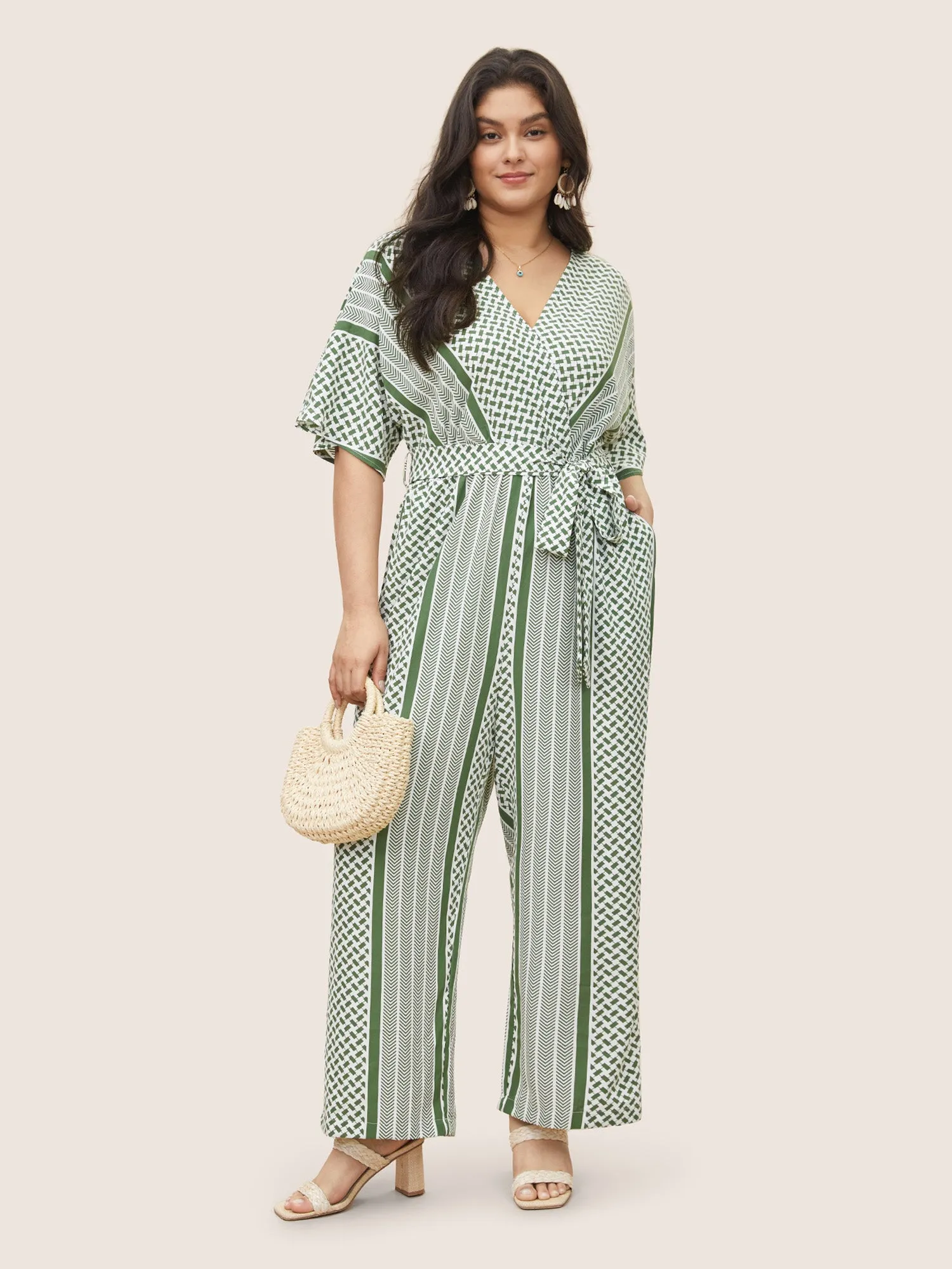 Geometric Contrast Dolman Sleeve Pocket Belted Wrap Jumpsuit sold by Bloomchic