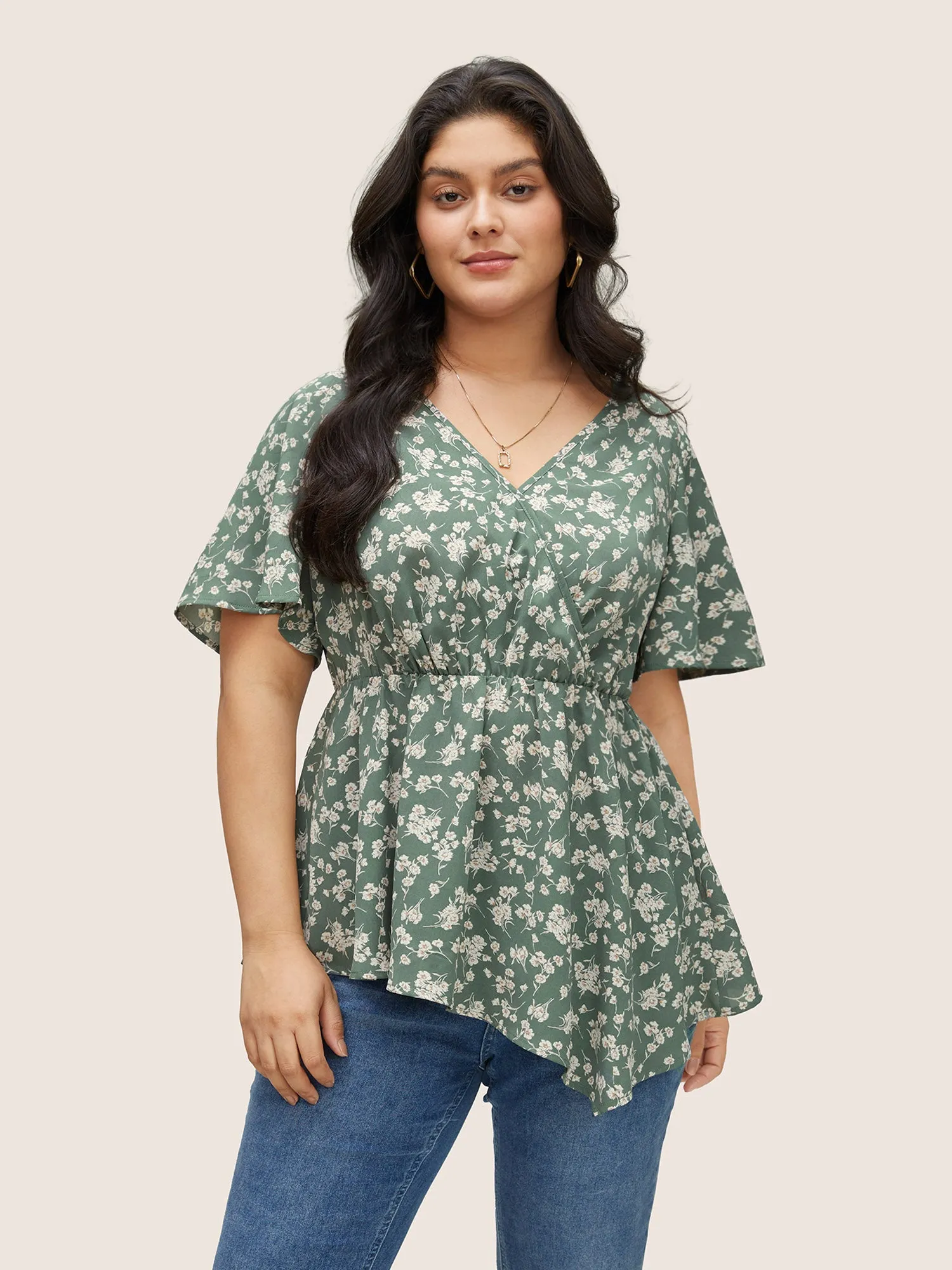 Ditsy Floral Elastic Waist Wrap Asymmetrical Hem Blouse sold by Bloomchic