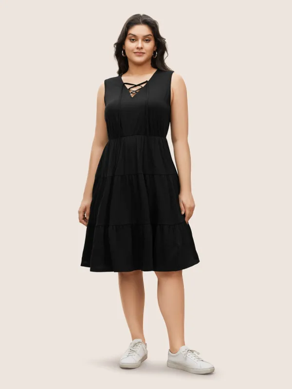 Solid Ruffle Layered Hem Lace Up Dress sold by Bloomchic