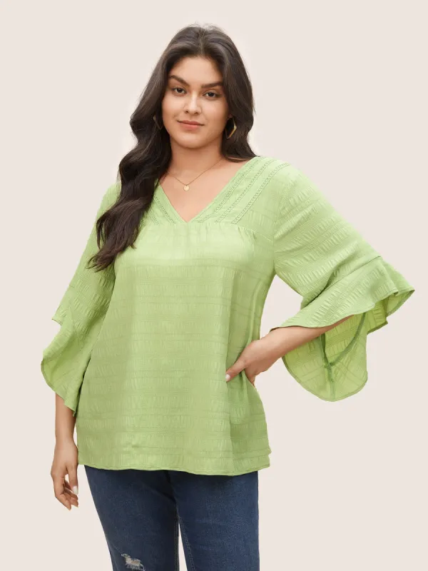 Solid Textured Gathered Ruffle Sleeve Blouse sold by Bloomchic
