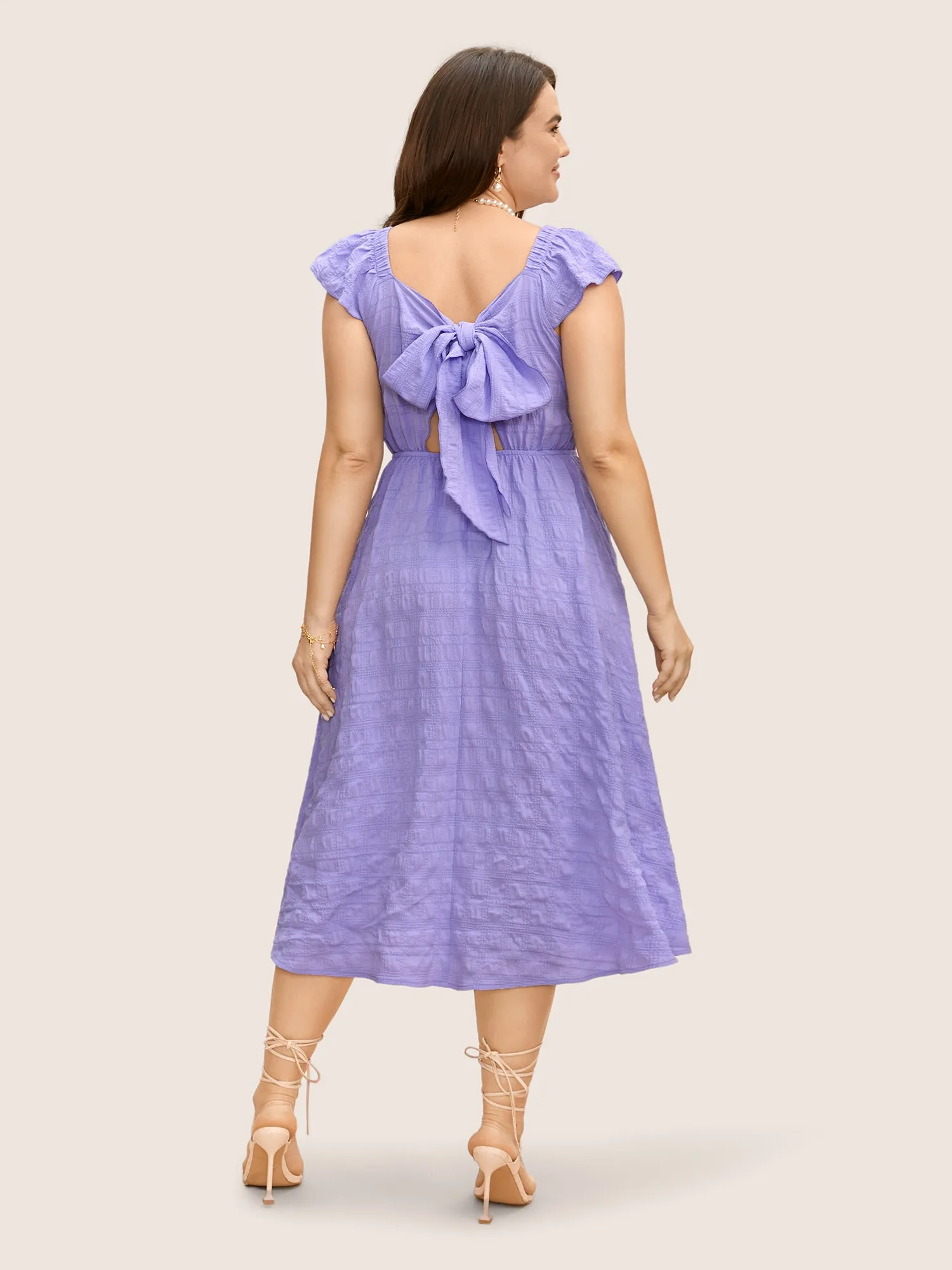 Texture Back Tie Knot Cap Sleeve Dress sold by Bloomchic