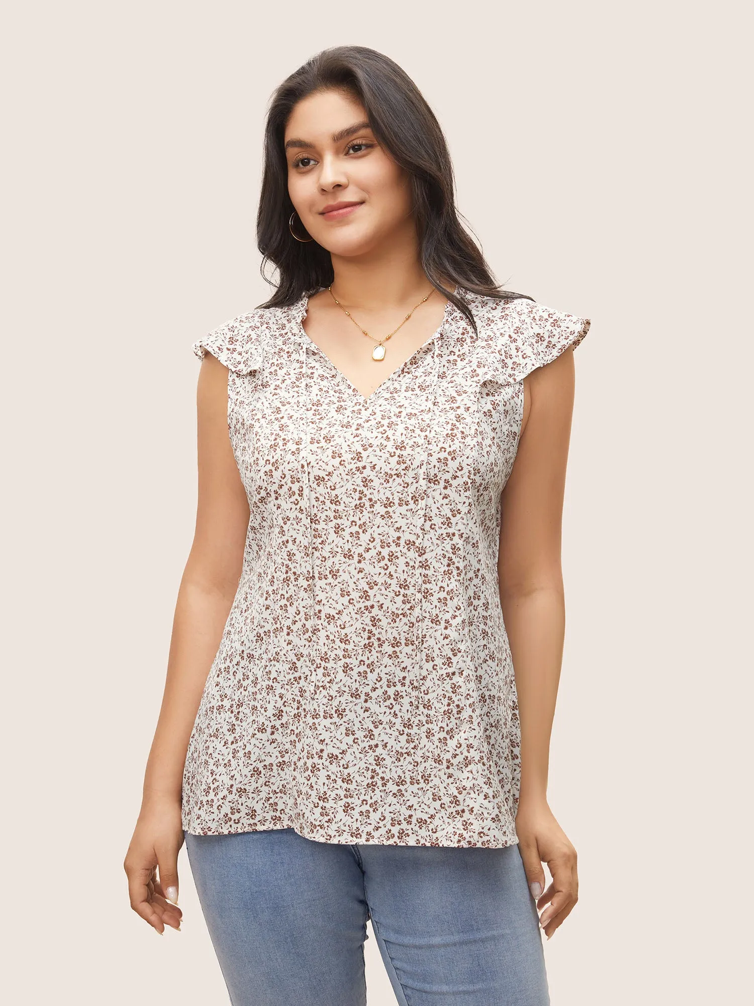 Ditsy Floral Tie Neck Ruffle Cap Sleeve Blouse sold by Bloomchic