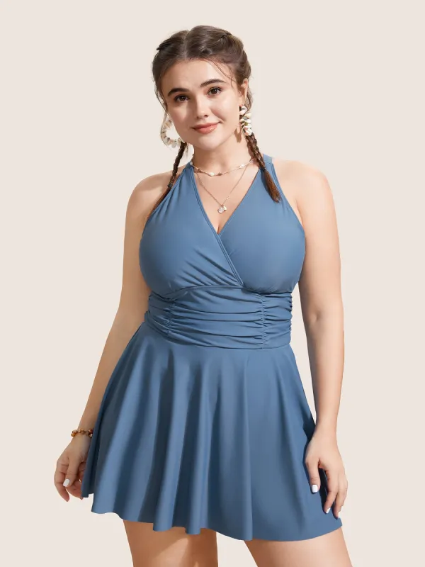 Plain Overlap Collar Ruched Swim Dress sold by Bloomchic