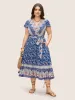 Boho Print Surplice Neck Belted Dress sold by Bloomchic