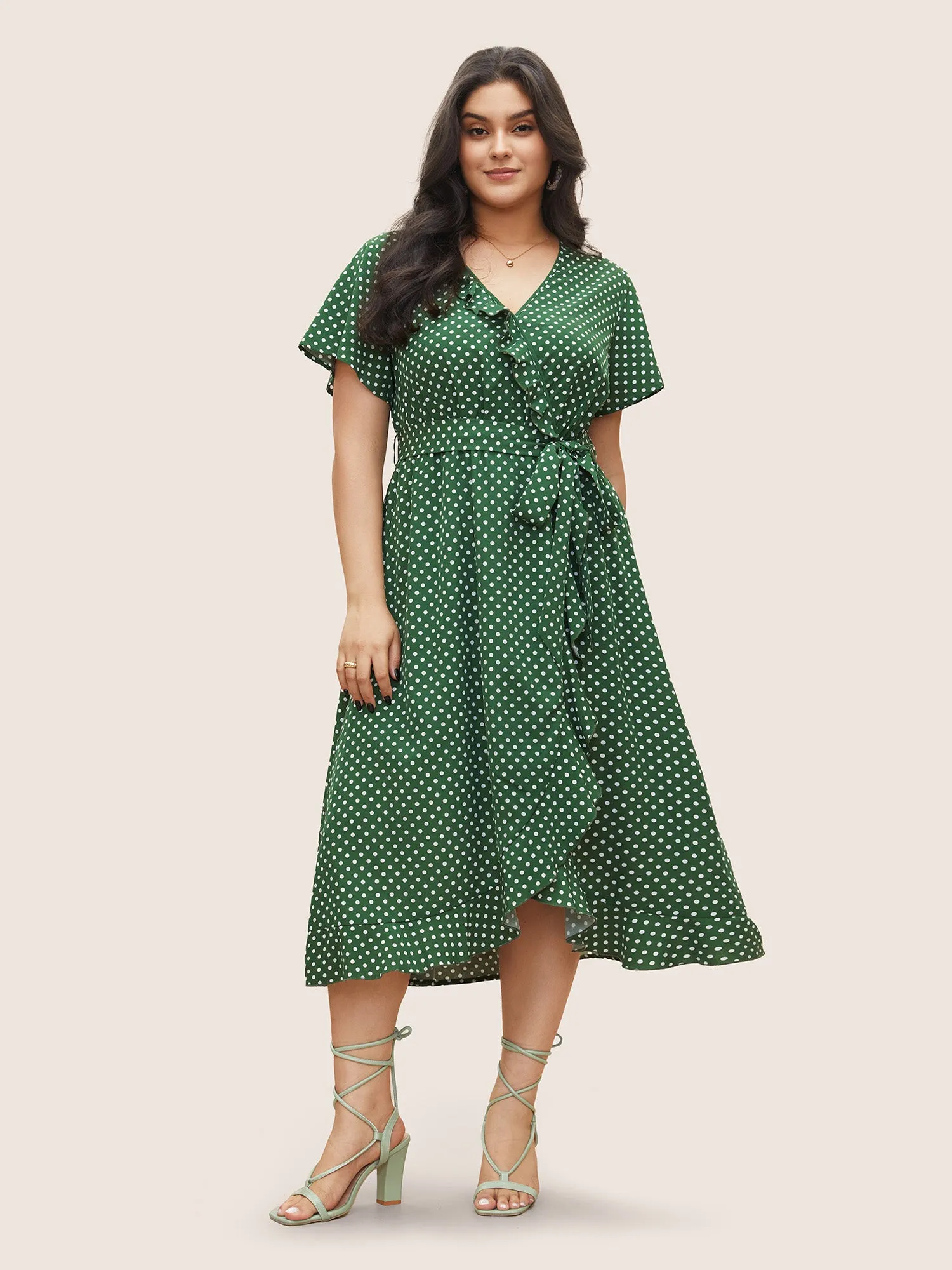 Polka Dot Flutter Trim Belted Overlap Collar Dress sold by Bloomchic