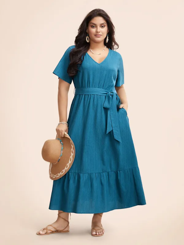 Textured V Neck Belted Ruffle Hem Dress sold by Bloomchic