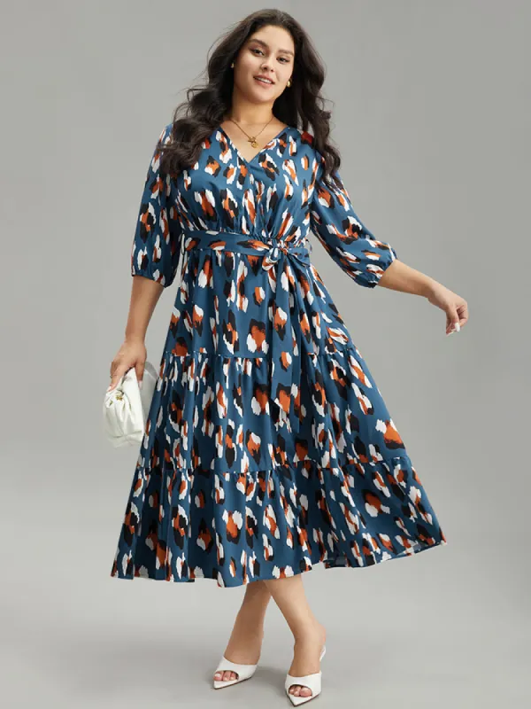Allover Print Ruffle Layered Hem Wrap Belted Dress sold by Bloomchic