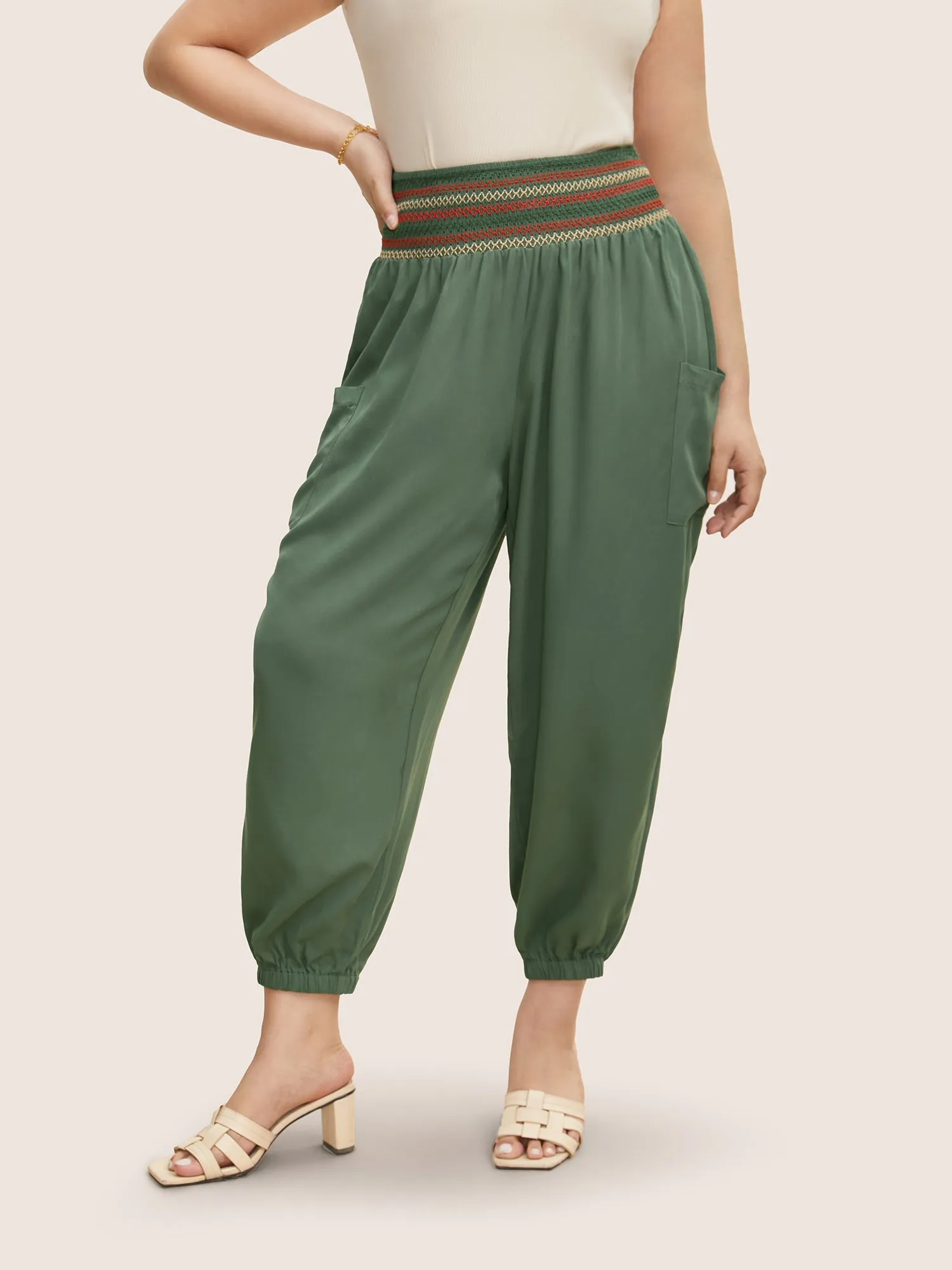 Mid Rise Shirred Tapered Leg Pants sold by Bloomchic