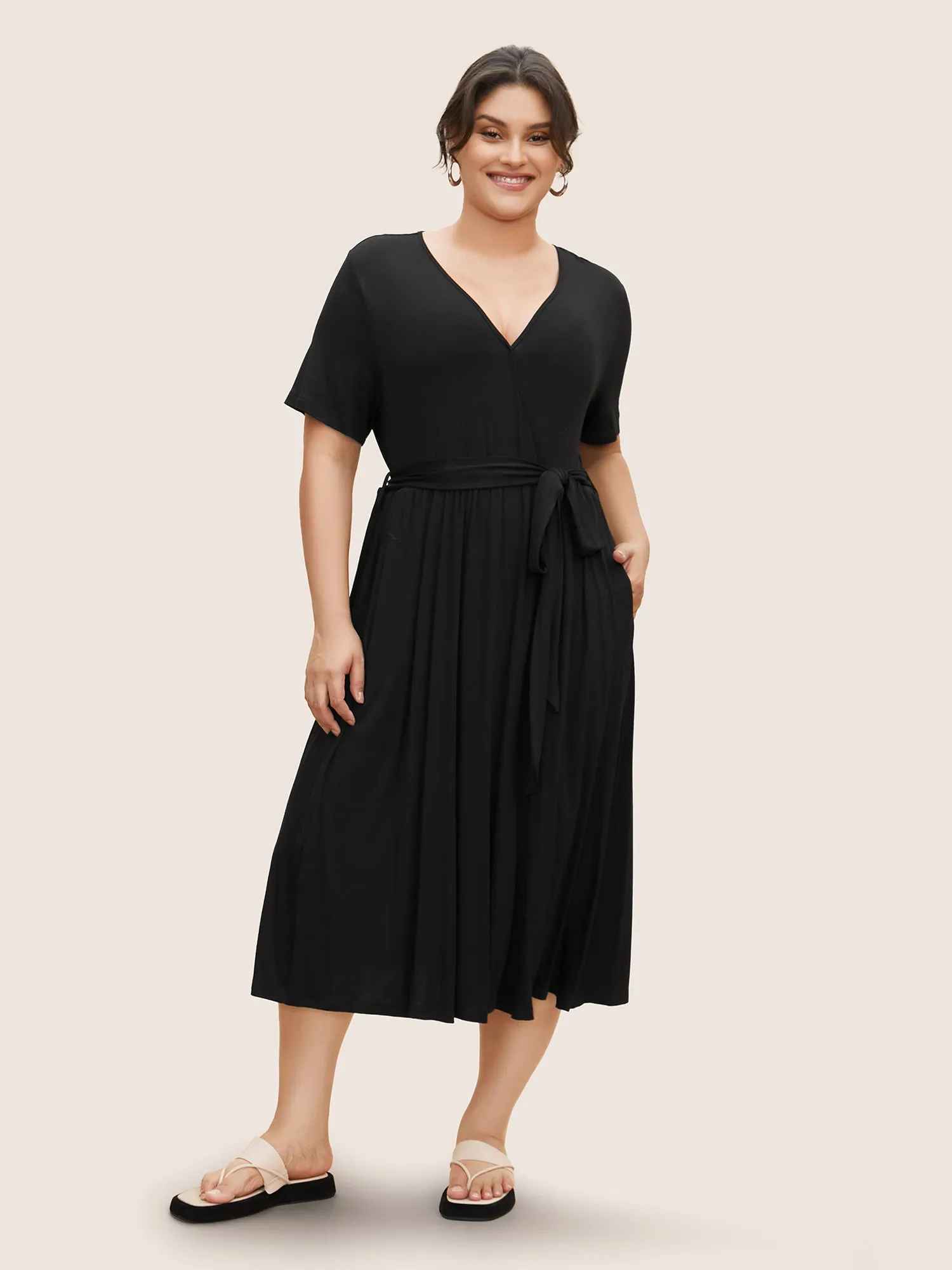 Overlap Collar Solid Belted Midi Dress sold by Bloomchic